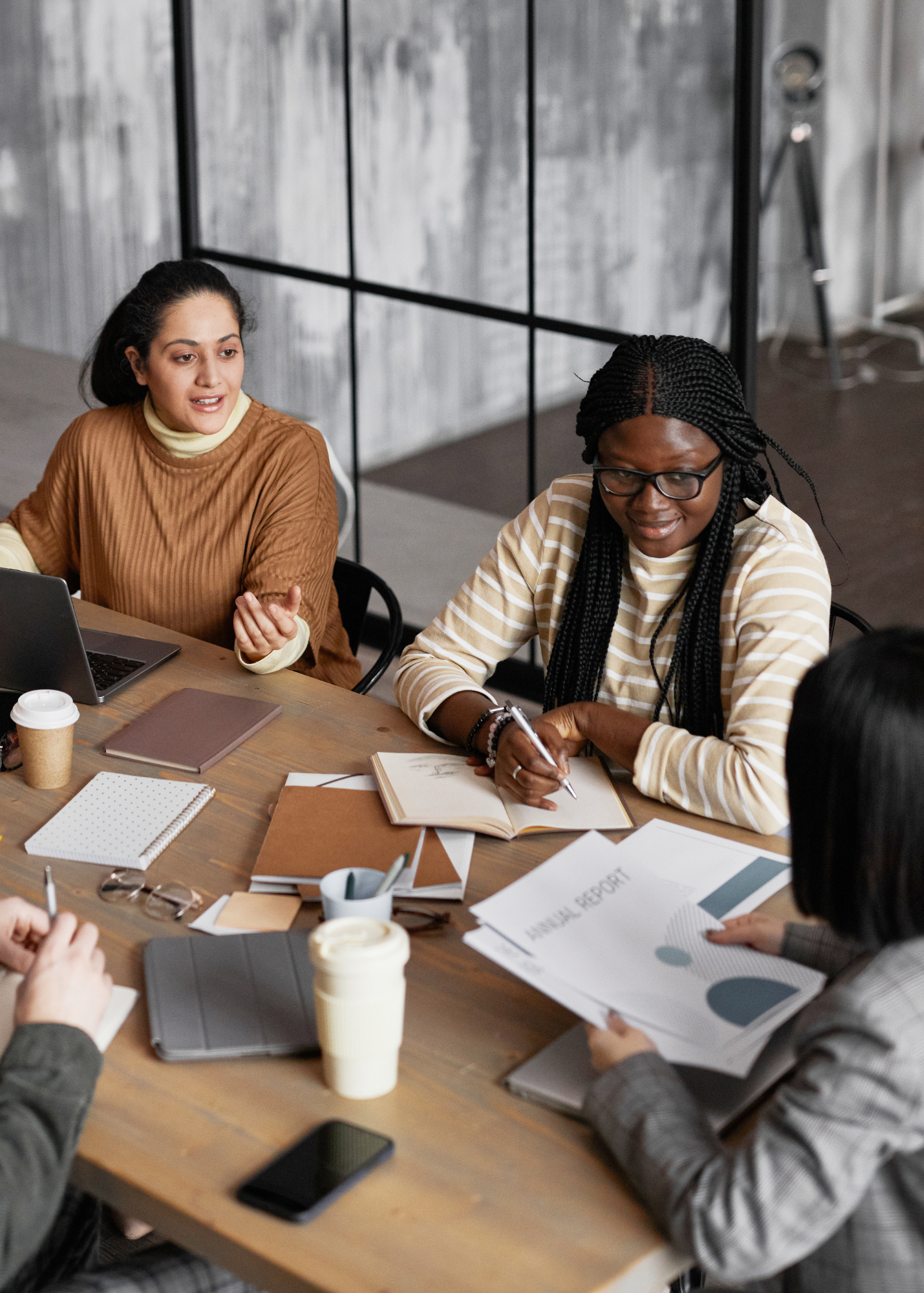 Three women working together in a shared-power workplace