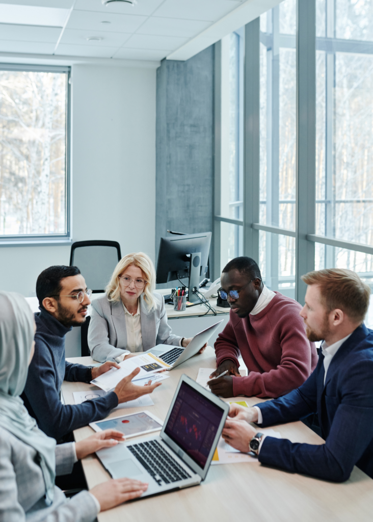 Five diverse individuals having a health and empowering work meeting